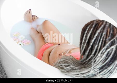 Pregnant wife taking a bath
