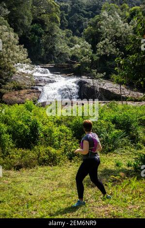 Strong water current of crystal clear water from Paraibuna river flowing around rock formations inside Serra do Mar estate park. Stock Photo