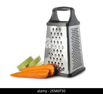 Metal grater, carrots and zucchini on white background Stock Photo