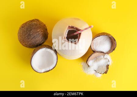 Fresh and ripe coconuts on color background Stock Photo