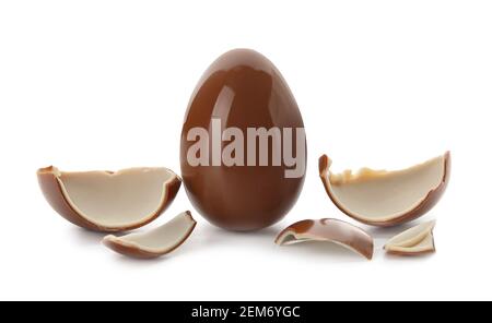 Whole and broken chocolate Easter eggs on white background Stock Photo
