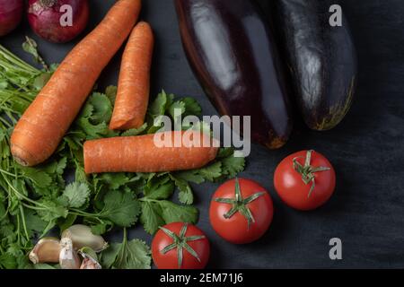 Various types of fresh vegetables on black background Stock Photo
