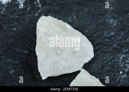 Crystalized salt rocks on dark background. Close up Stock Photo