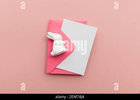 Easter blank card and envelope with white easter bunny Stock Photo