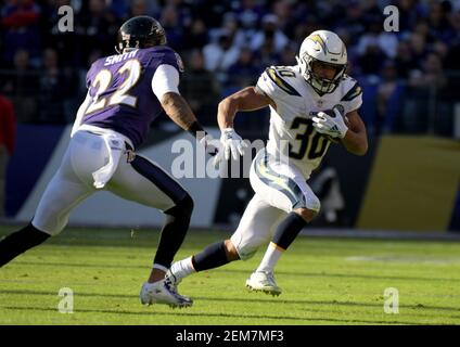 Jan 6, 2019; Baltimore, MD, USA; Los Angeles Chargers running back Austin Ekeler (30) carries the ball defended by Baltimore Ravens cornerback Jimmy Smith (22) during an AFC Wild Card playoff football game at M&T Bank Stadium. Mandatory Credit: Kirby Lee-USA TODAY Sports/Sipa USA