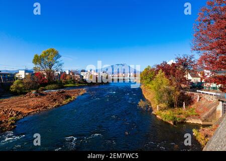 Mount Iwate scene with buildings and promenade at Katakami river in Morioka city, Iwate, Japan. Stock Photo