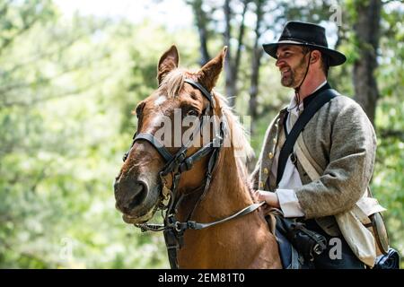 Marbury, Alabama/USA-April 28, 2018: Portrait of a Confederate soldier on horseback with out of focus background at Confederate Memorial Park. Stock Photo