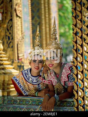 Asia,Thailand, Bangkok,portrait of Two beautiful smiling Thai Girls wearing traditional dancing costume Stock Photo