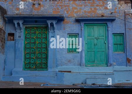 Blue white washed walls and painted doors of old house of jodhpur city, jodhpur, Rajasthan, India. Stock Photo