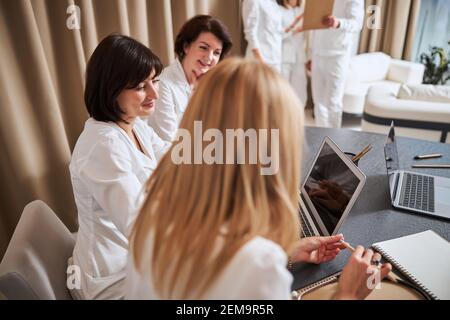 Medical workers sitting at the table during a staff meeting Stock Photo