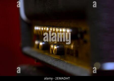 Knobs for volume, tone and various settings on the guitar amp. Guitar combo. Close up. Selective focus Stock Photo