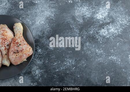 Top view of raw marinated chicken legs Stock Photo