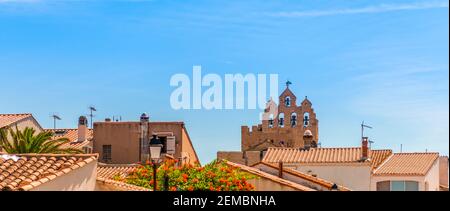 The roofs of Saintes-Maries-de-la-mer and the bell tower of the church, Provence, France Stock Photo