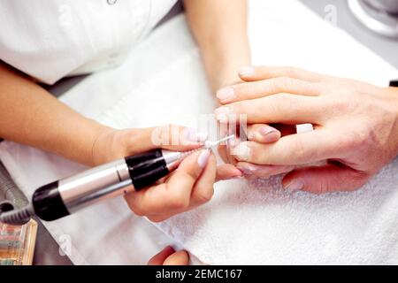 Manicure for men, electric nail file, concept of neat and healthy nails  Stock Photo - Alamy