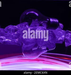 Painting with light on a mirror with small colored lamps and a lightbulb. Stock Photo