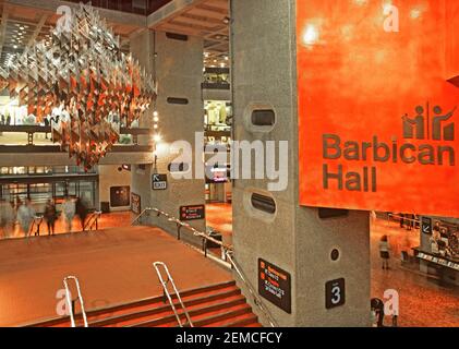 Archive 1988 historical interior view of entrance steps and modern chandelier over the foyer at the Barbican Hall home of the London Symphony Orchestra and the BBC Symphony Orchestra are both based at the Grade II listed Barbican centre building a performing arts and entertainment venue funded and maintained by City of London Corporation in London England UK an 1980s archive image of the way we were Stock Photo