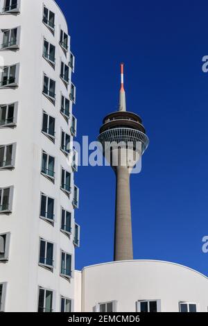 Rheinturm telecoms tower and Neuer Zollhof (The New Zollhof) Frank O. Gehry buildings,  Dusseldorf, Germany Stock Photo