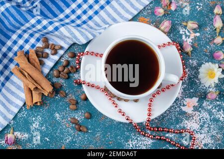 A cup of tea with cinnamon sticks on the table Stock Photo