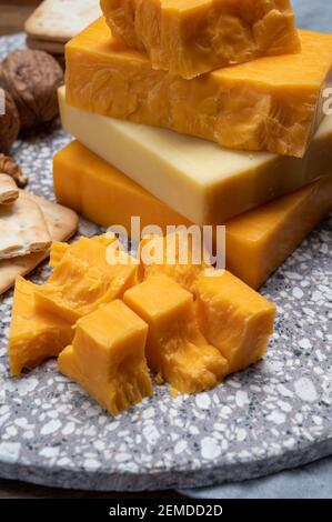 Cheese collection, orange and yellow smoked British cheese from England close up Stock Photo