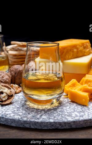 Cheese collection, orange and yellow smoked British cheese from England close up Stock Photo