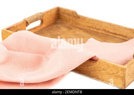Wooden board and kitchen towel on white background. Stock Photo