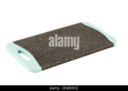 Black plastic cutting board isolated on white background. Stock Photo