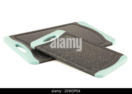Two black plastic cutting boards isolated on white background. Stock Photo