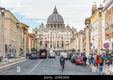 Rome, Italy - Oct 05, 2018: Tourists admire the magnificent view of the Cathedral of St. Peter from Via della Consiliazione in Rome Stock Photo