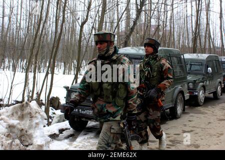 SRINAGAR, INDIA – FEBRUARY 12: Security forces near the site of encounter at the Ratnipora area of south Kashmir's Pulwama district, some 30 kilometers south of Srinagar, on February 12, 2019 in Jammu and Kashmir, India. A soldier and a militant were killed while a residential house where the militants were hiding was damaged in the fierce gunfight. (Photo by Waseem Andrabi/ Hindustan Times/Sipa USA)