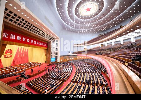 Beijing, China. 25th Feb, 2021. A grand gathering is held to mark the nation's poverty alleviation accomplishments and honor model poverty fighters at the Great Hall of the People in Beijing, capital of China, Feb. 25, 2021. Credit: Li Xiang/Xinhua/Alamy Live News Stock Photo