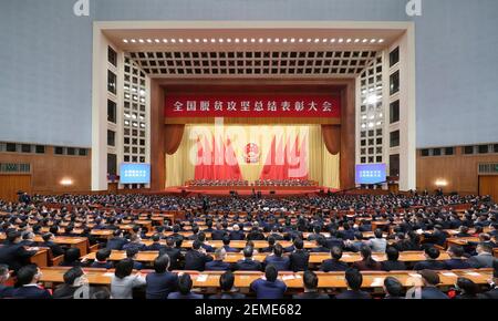 Beijing, China. 25th Feb, 2021. A grand gathering is held to mark the nation's poverty alleviation accomplishments and honor model poverty fighters at the Great Hall of the People in Beijing, capital of China, Feb. 25, 2021. Credit: Ding Lin/Xinhua/Alamy Live News Stock Photo