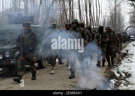 SRINAGAR, INDIA – FEBRUARY 12: Security forces near the site of encounter at the Ratnipora area of south Kashmir's Pulwama district, some 30 kilometers south of Srinagar, on February 12, 2019 in Jammu and Kashmir, India. A soldier and a militant were killed while a residential house where the militants were hiding was damaged in the fierce gunfight. (Photo by Waseem Andrabi/ Hindustan Times/Sipa USA)