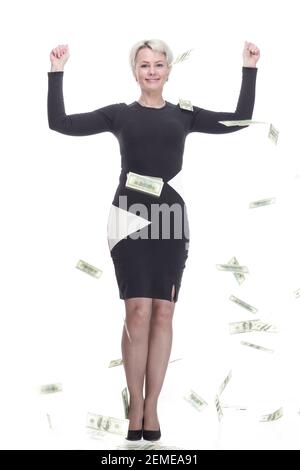 attractive young woman standing in the rain of banknotes Stock Photo