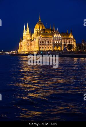 Hungarian Parliament next to the river Danube in Budapest at blue hour after sunset; color photo. Stock Photo