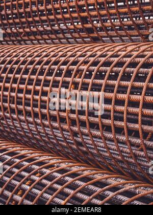Iron on construction site. Rusty Iron Bundle for making reinforcement concrete . rebar for reinforce hole in the ground. Texture background net metal Stock Photo