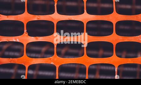 orange plastic net on construction site. Texture background of net. orange rectangle pattern Stock Photo