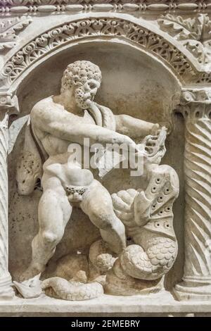 Rome, Italy - Oct 05, 2018: Heracles breaks snake's mouth, bas-relief Stock Photo