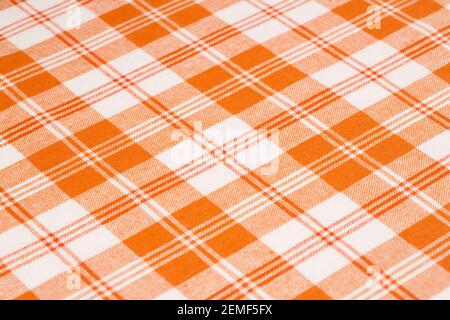 Orange and white kitchen towels texture as a background, vertical picture. Stock Photo