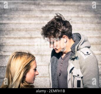 Couple in a moment of troubles during break up phase - Dramatic scenario with boyfriend and girlfriend and lack of communication - Concept of sadness Stock Photo