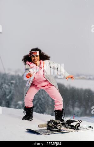 Young African American Skier Woman With Curly Hair Wearing Snow 