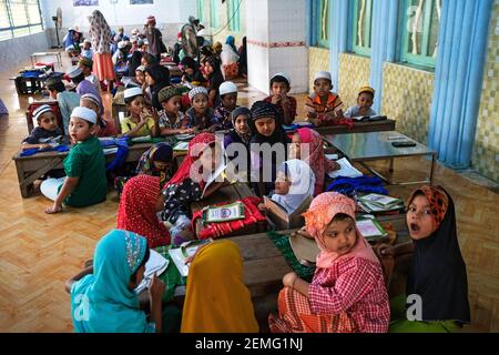 Children in a madrasah, Koran school, camp for Rohingya refugees from ...