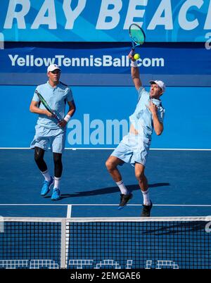 February 23, 2019: Mike Bryan (right), of the United States, hits an overhead, as his brother Bob (left) follows the action, during their seminal doubles match against Jamie Cerretani, of the United States, and Marcelo Arevalo, of El Salvador, at the 2019 Delray Beach Open ATP professional tennis tournament, played at the Delray Beach Stadium & Tennis Center in Delray Beach, Florida, USA. The Bryan brothers won 6-3, 7-5. Mario Houben/(Photo by Mario Houben/CSM/Sipa USA)