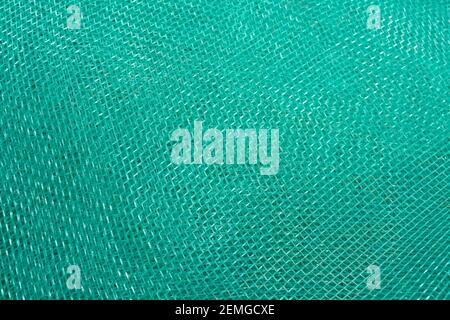 Green mesh. Green textile background. Stock Photo