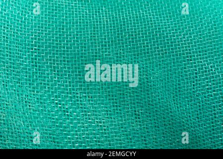 Green mesh. Green textile background. Stock Photo