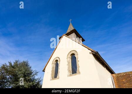 Exterior of the small, historic Wisley Church dating back to Norman times in about 1150, in the Parish of Wisley with Pyrford, Surrey, on a sunny day Stock Photo