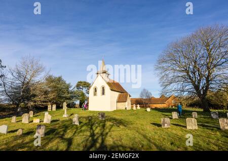 Exterior of the small, historic Wisley Church dating back to Norman times in about 1150, in the Parish of Wisley with Pyrford, Surrey, on a sunny day Stock Photo