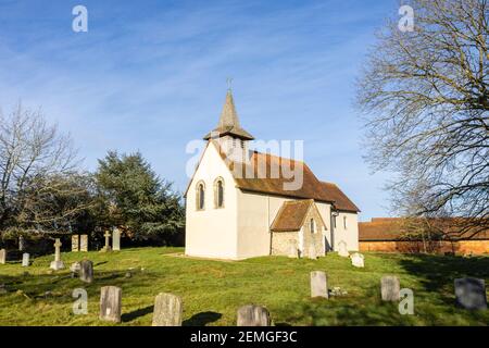 Exterior of the small, historic Wisley Church dating back to Norman times in about 1150, in the Parish of Wisley with Pyrford, Surrey, on a sunny day Stock Photo