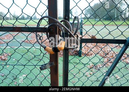 Combination Padlock on Steel Fence Gates Stock Photo