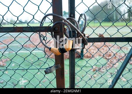 Combination Padlock on Steel Fence Gates Stock Photo