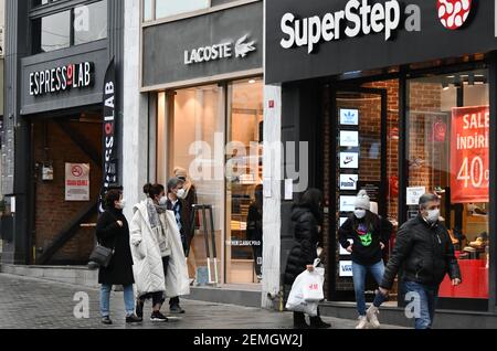 (210225) -- ISTANBUL, Feb. 25, 2021 (Xinhua) -- People walk past stores in Istanbul, Turkey, Feb. 25, 2021. Choked off by the coronavirus, the number of foreigners visiting Turkey stood at 12.7 million in 2020, dropping by 71.7 percent from the previous year mainly because of global travel restrictions and lockdowns, the Culture and Tourism Ministry announced recently. (Xinhua/Xu Suhui) Stock Photo